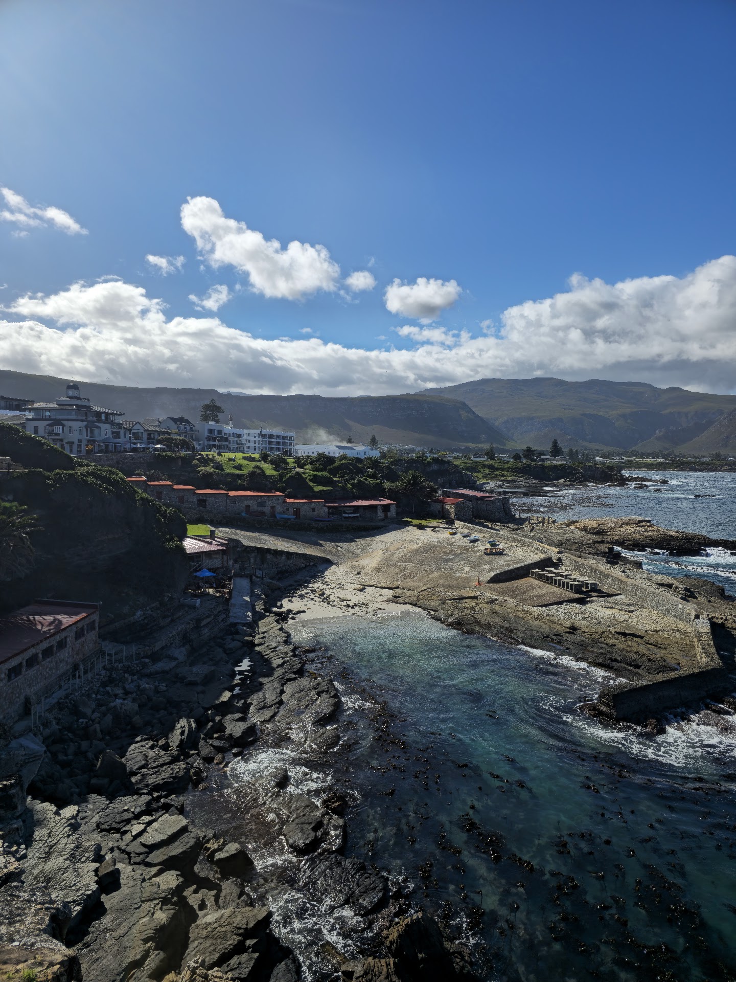 Rocky Hermanus coastline with kelp beds and cliffs along Walker Bay