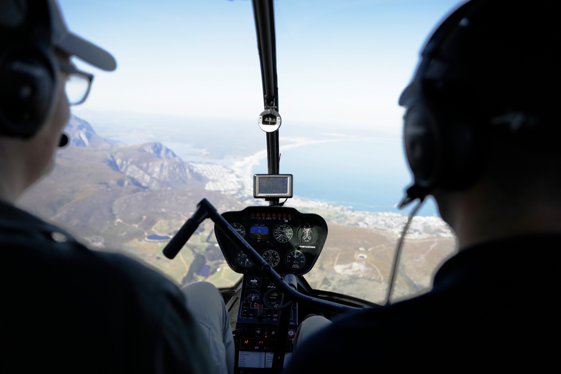 Aerial view of Walker Bay and the Hermanus coastline from a helicopter cockpit